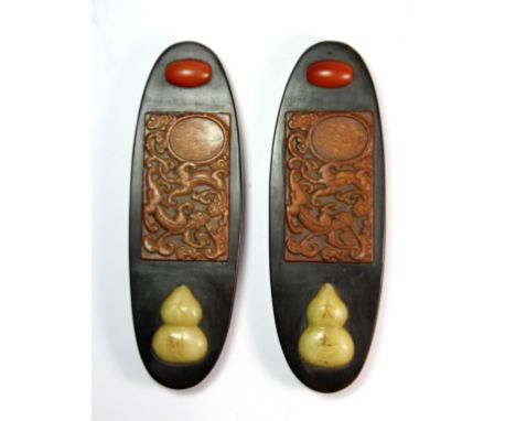 A pair of fine quality Chinese hardwood scroll weights, inset with mixed colour jade, L. 22cm.