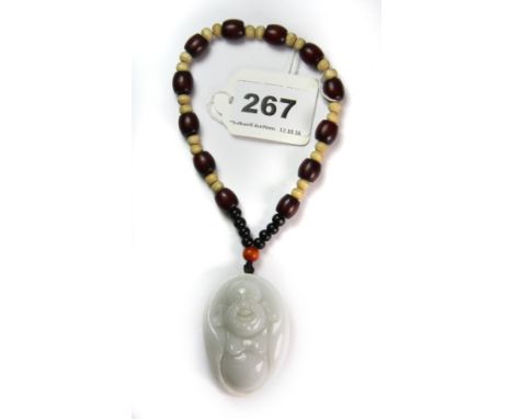 A finely carved Chinese white jadeite jade amulet of The Happy Buddha, L. 5.5cm.
