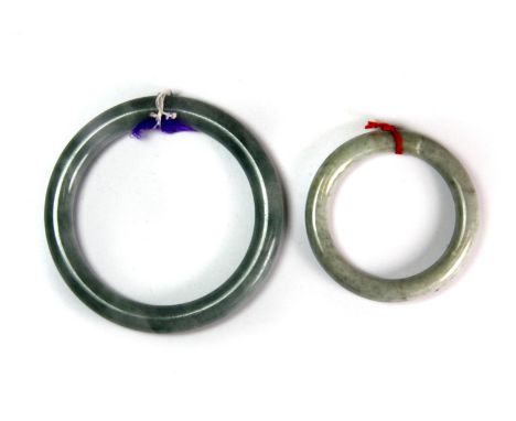 Two carved Chinese jade bangles.