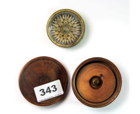 A 19th century satinwood cased compass. Case diameter 7cm.