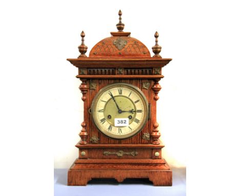 A 19th century oak and brass striking mantle clock, H. 49cm.
