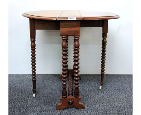 A pretty Edwardian mahogany Pembroke style side table with bobbin turned legs terminating in porcelain castors, H. 59cm W. 44