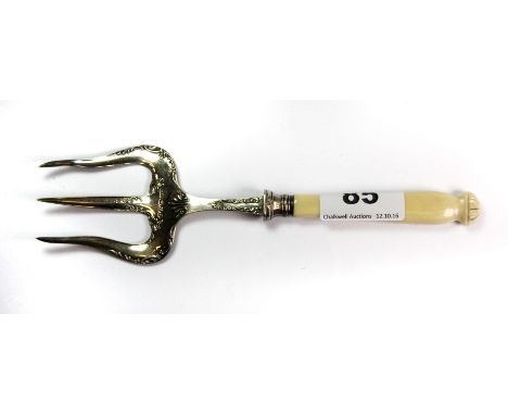 A Sheffield 1895 hallmarked silver bread fork with a carved ivory handle, L. 20cm.