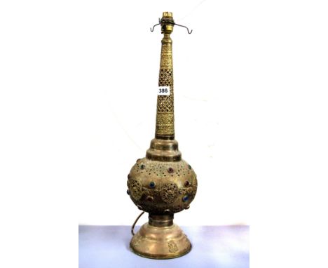 An Indian hammered brass and jewelled lamp base, H. 56cm.