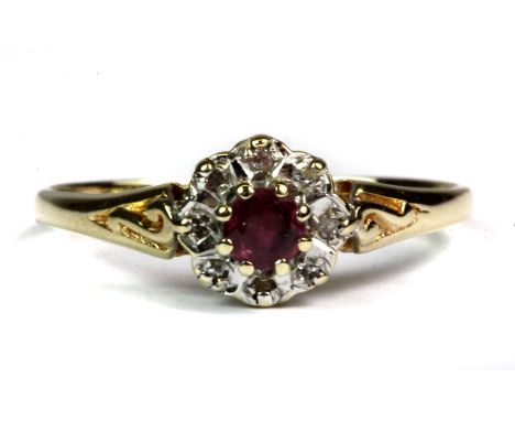 A pretty 9ct yellow and white gold ruby and diamond cluster ring (P).