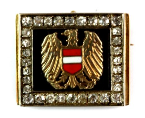 A yellow metal (tested 14ct gold) and enamel diplomatic brooch set with diamonds, bearing the coat of arms of the Republic of