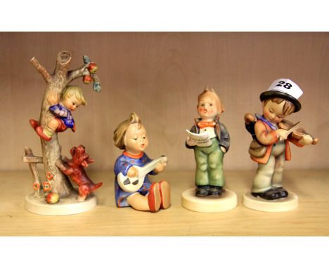 Four Hummel figures of children.