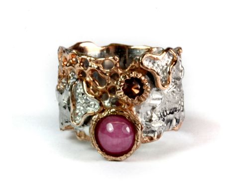 A Hana Maae designer 925 silver gilt ring set with a cabochon cut ruby and an almondine garnet (R).