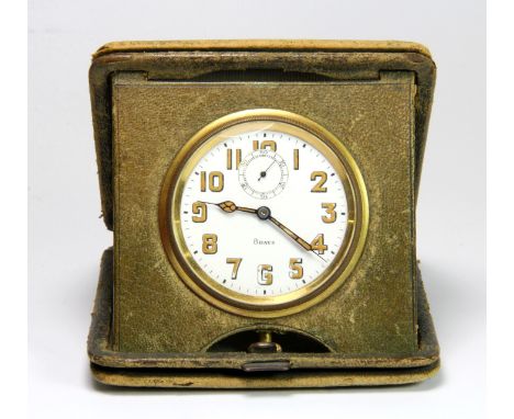 A 1920's leather cased folding travelling 8 day alarm clock.
