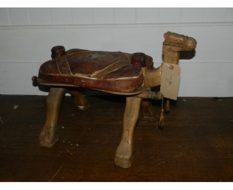 An early 20th century camel stool.