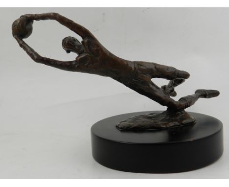 A Kim Barnard bronze study of a gentleman catching ball, mounted on a circular wooden base, bears signature to side, H.17cm 