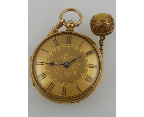 A late 19th / early 20th century 18ct yellow gold pocket watch, having a Roman baton dial, together with a yellow metal fob a
