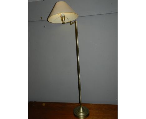 An angle poised brushed brass standard lamp, with shade. H: 132cm 