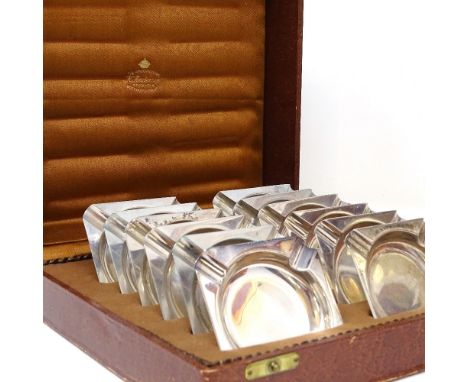 A set of 12 Art Deco Swedish silver ashtrays, by K Anderson, hallmarks Stockholm 1933/4/5, length 6.5cm, 8.3oz total, origina