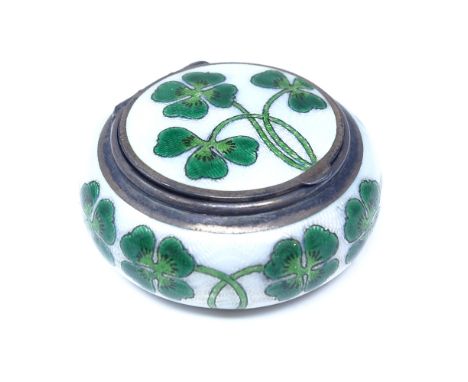 A novelty sterling silver and enamel lucky four leaf clover pill box, circular form with gilt hinged lid and enamelled interi