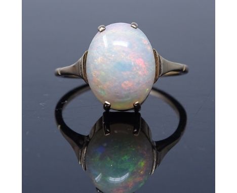 An unmarked gold cabochon opal dress ring, opal length 12mm, size L, 2g (shank split)

Good overall condition, the shank is s