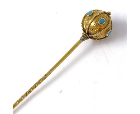 A Victorian unmarked gold turquoise orb stick pin, ropetwist straps with floral engraved decoration set with cabochon turquoi