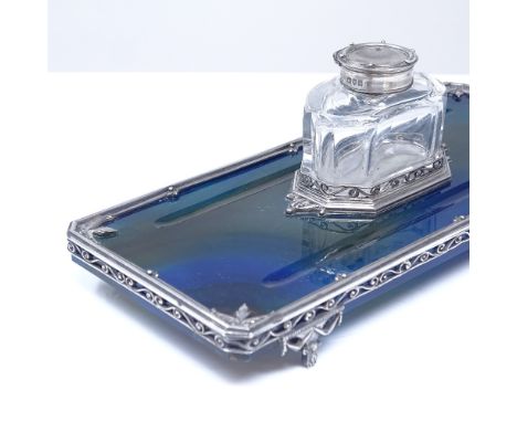 An Edwardian polished blue agate and silver inkwell desk stand, with removable cut-glass silver-mounted inkwell, reeded and p