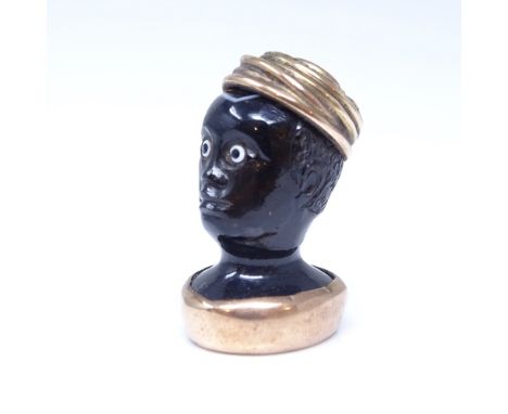 A 19th century banded agate figural Blackamoor seal fob, unmarked rose gold mounts with cabochon turquoise headdress and inta