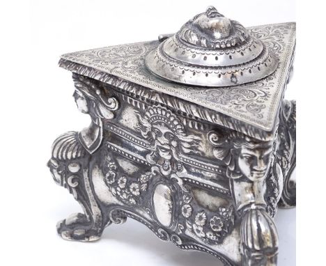A 19th century Austro-Hungarian cast-silver inkwell, triangular form with Empire-style decoration, relief embossed classical 