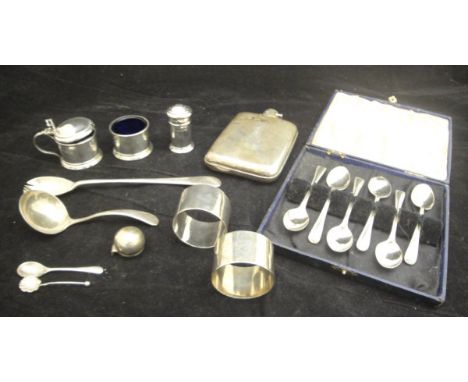 A quantity of various small silver wares to include hip flask, pickle fork, three piece cruet, napkin ring, sauce ladle, two 