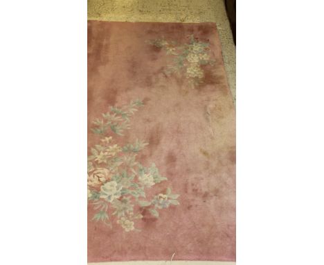 A Chinese superwash carpet, the pink ground set with two floral sprays 154 cm x 91 cm, together with a similar Chinese rug, t