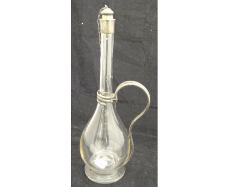 A liqueur decanter with white metal mounts, the handle collar in the form of a double-headed serpent
