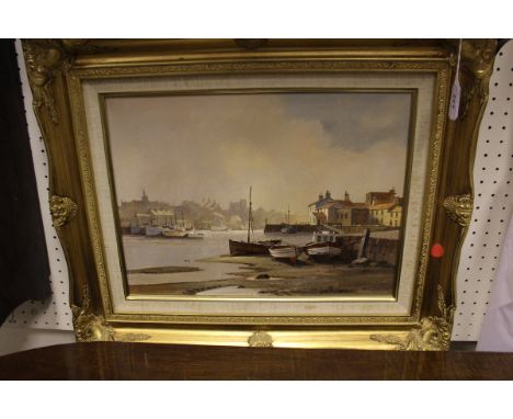 DON MICKLETHWAITE (b.1936) "Yorkshire coast", a harbour scene with beached boats in foreground, oil on canvas, signed bottom 