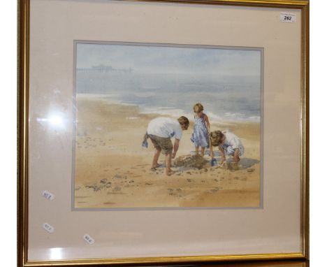 MARY GUNDRY "Making sandcastles", a study of three children playing on a sandy beach, watercolour, signed lower left
