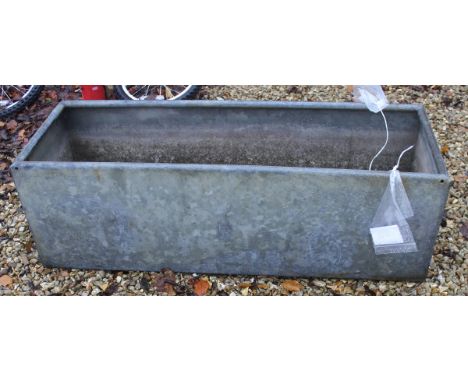 A galvanised rectangular trough