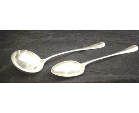 An Edwardian silver serving spoon of "Rat Tail" design (by Walker & Hall, Sheffield, 1905), together with a matched ladle (by