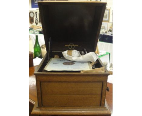 A vintage Columbia oak cased gramophone, inscribed to the interior "Viva-Tonal Grafonola" and No'd. 117A, together with two r