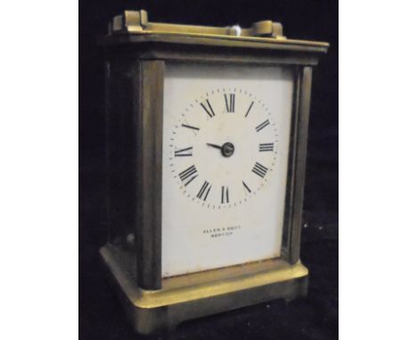 A circa 1900 French lacquered brass cased carriage clock by R & Co. of Paris, the white enamelled dial with Roman numerals in