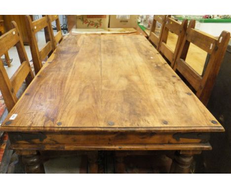 An Eastern hardwood rectangular dining table and six ladder-back panel seat dining chairs, together with two prints CONDITION