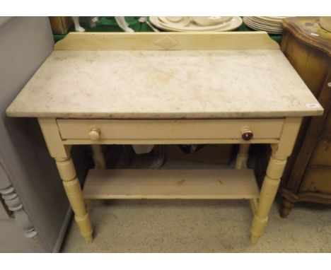 A white marble topped wash stand with single drawer on turned legs united under tier 