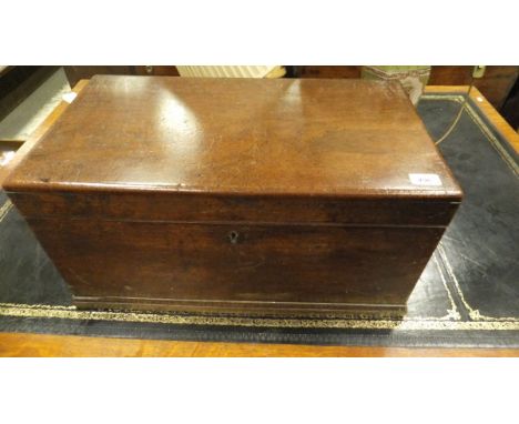 A circa 1900 plain camphor wood trunk with wrought iron handles