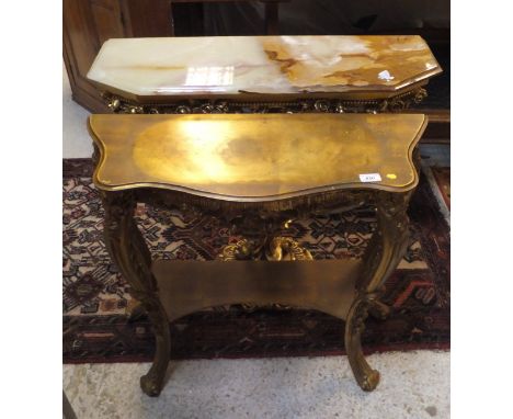 A gilt effect hall table in the French taste raised on cabriole legs united by an undertier, a modern Onyx topped console tab