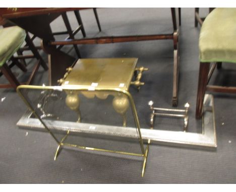 A polished steel fire kerb, a pair of fire dogs and a brass rimmed mesh fire screen  