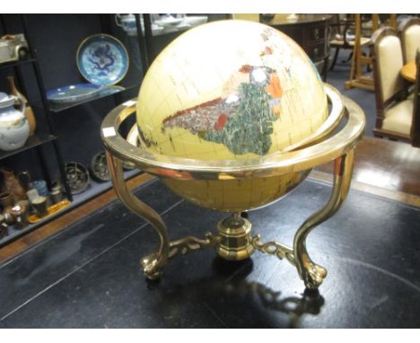 A modern globe inlaid with mother of pearl and other stone  