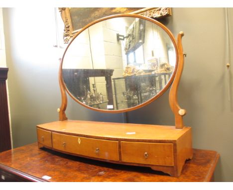 A late 19th century bow front dressing table mirror, 84cm wide  