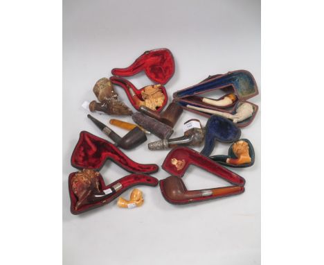 A Victorian hand pipe, together with three meerschaum pipes in the form of ladies and eight other pipes  