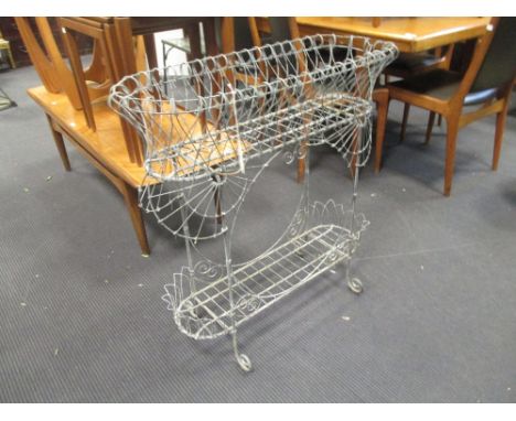 A wirework planter and two concrete urns (3)  