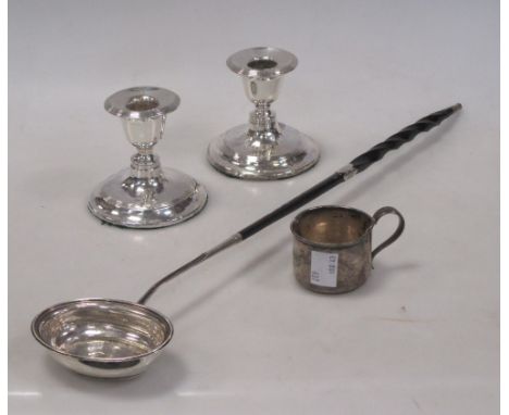 A pair of silver dwarf candlesticks, Birmingham 1908, together with a toddy ladle and cup (4)  