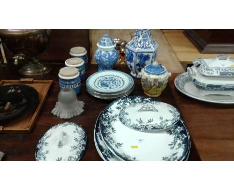 Three storage jars; a large blue and white Oriental vase; various meat plates; a biscuit barrel etc.