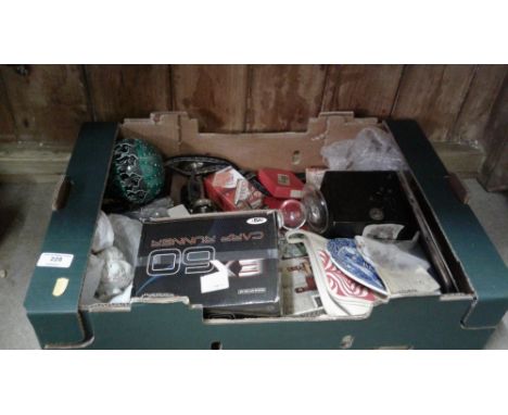 A box of various sundries to include marbles, camera, candlesticks etc. 