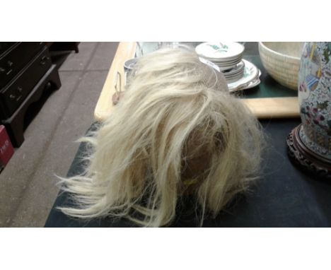 A wooden mannequin head