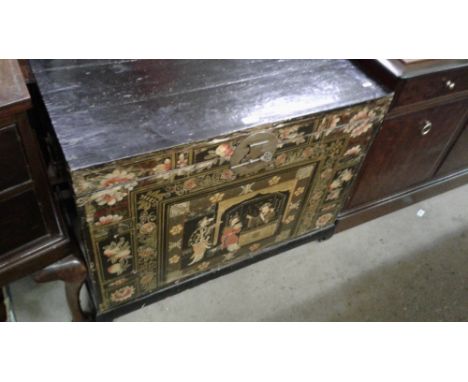 A Chinese black lacquered and figural decorated trunk
