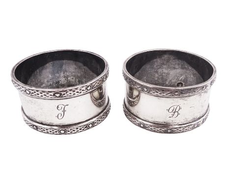 Pair of mid 20th century Scottish silver napkin rings, each with raised Celtic knot design borders and engraved initials to b