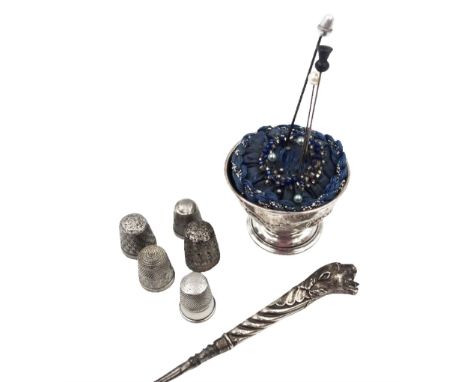 Group of silver sewing accessories, to include button hook, with silver leopard's head handle, hallmarks worn and indistinct,