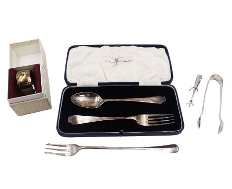 Group of silver, to include christening spoon and fork set, in fitted case, together with single napkin ring, two pairs of su